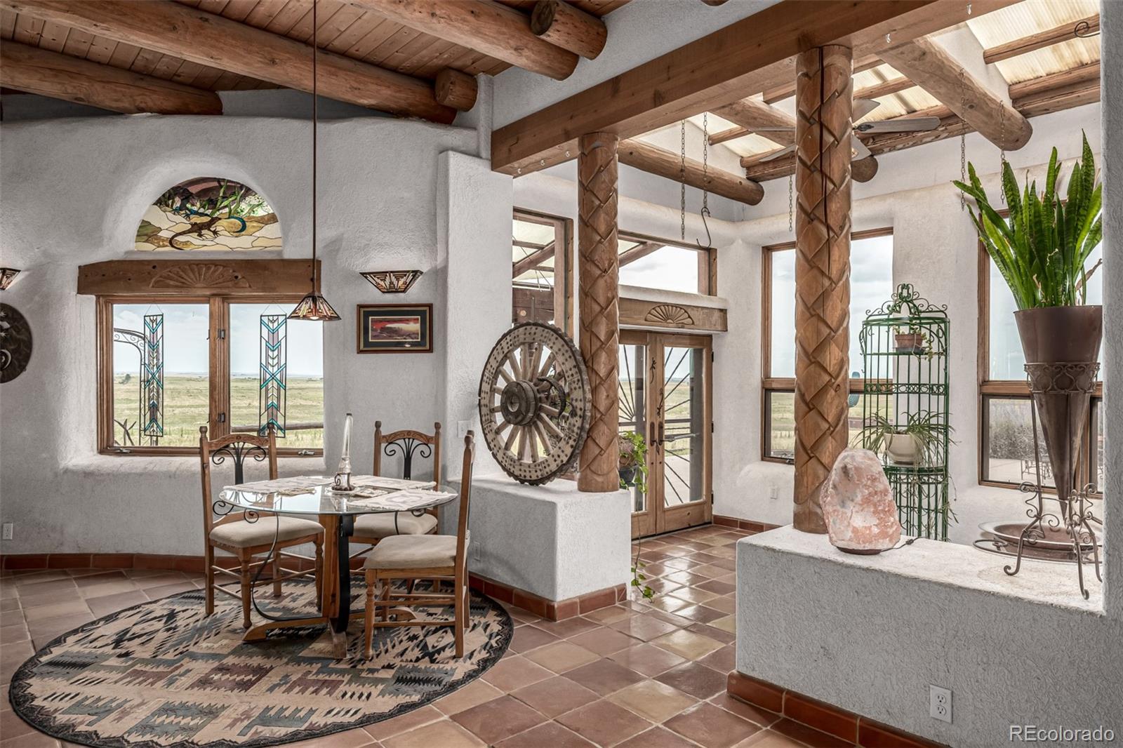 4601 County Road 161 Strasburg, CO 80136 - Photo 16 of 50 a living room with furniture a window and a table