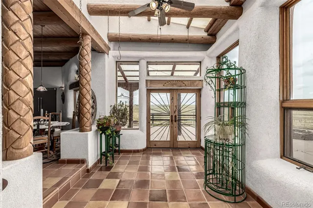 a view of a house with a yard and garage