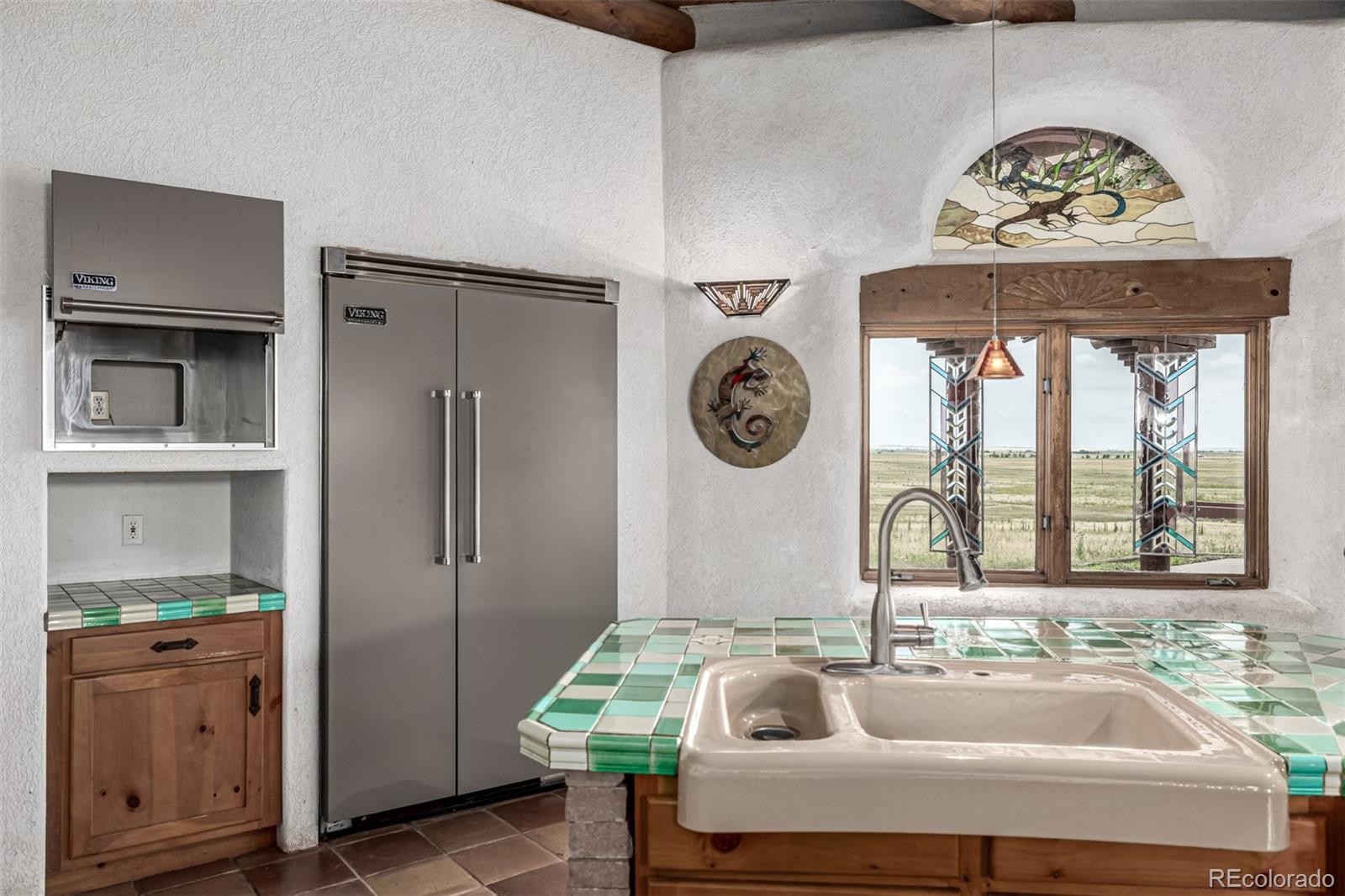 4601 County Road 161 Strasburg, CO 80136 - Photo 23 of 50 a bathroom with a sink and a large mirror
