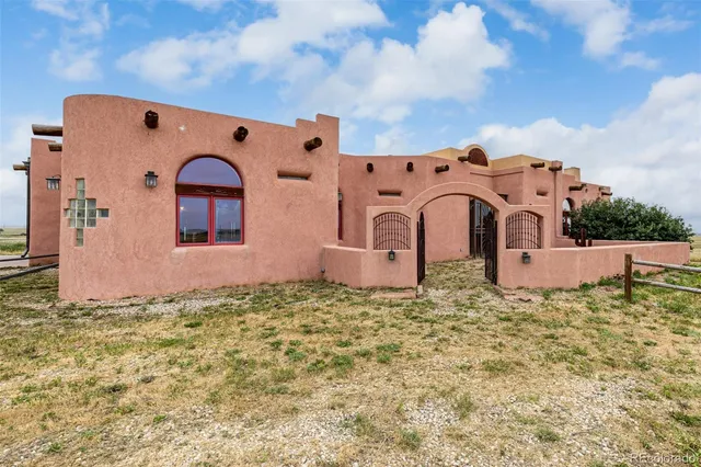 a living room with fireplace furniture and a flat screen tv