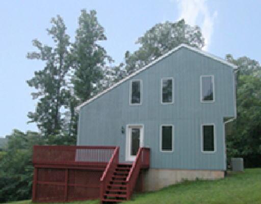 1344 Hickory Falls Road Blue Ridge, VA 24064 - Photo 1 of 5 a view of a house with a yard