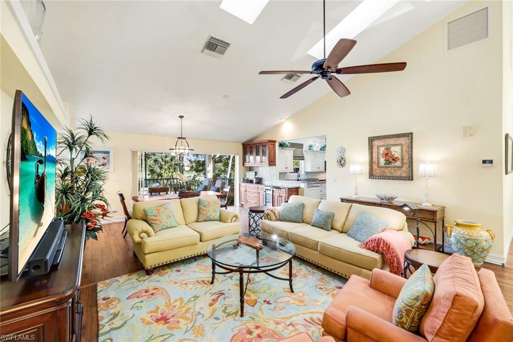 269 Perignon Place, Unit 162 Naples, FL 34119 - Photo 11 of 36 a living room with furniture ceiling fan and a rug