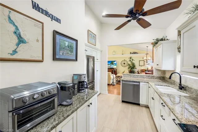 a kitchen with a stove and a sink