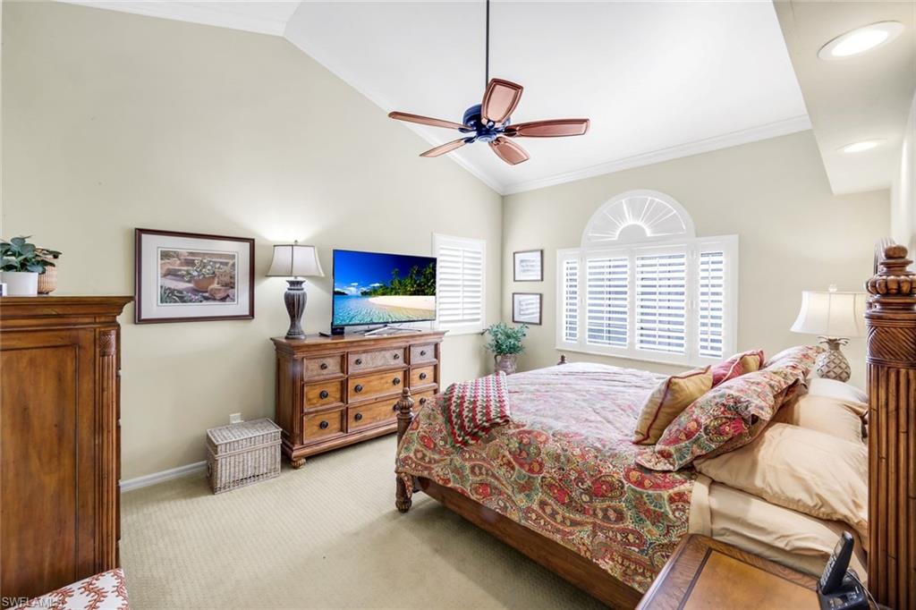 269 Perignon Place, Unit 162 Naples, FL 34119 - Photo 20 of 36 a bedroom with a bed and a flat screen tv