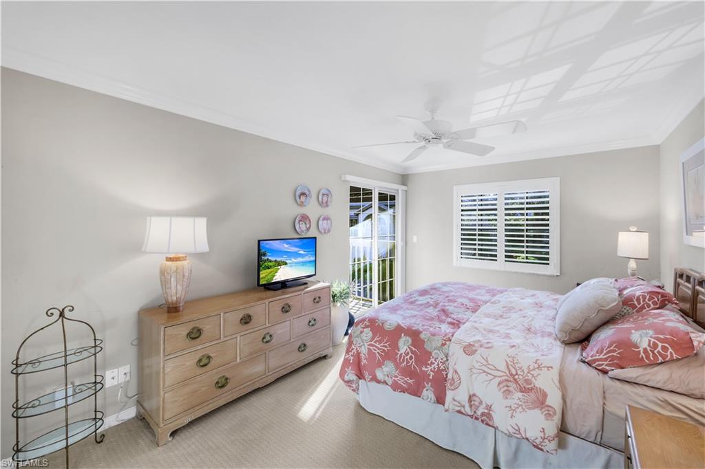 269 Perignon Place, Unit 162 Naples, FL 34119 - Photo 25 of 36 a bedroom with a bed and a dresser