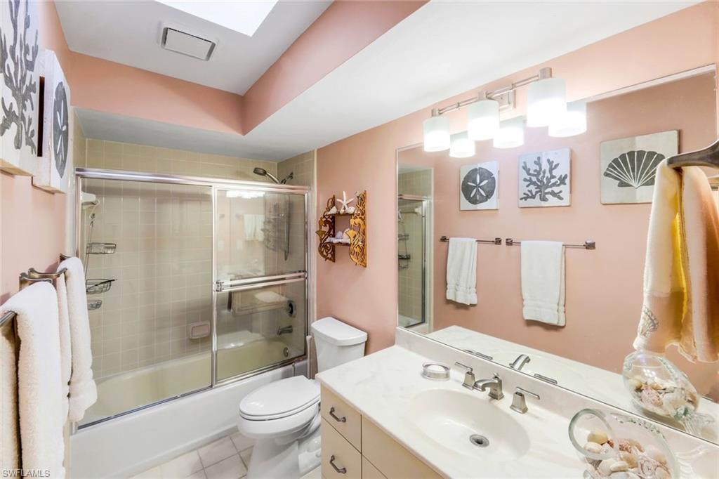 269 Perignon Place, Unit 162 Naples, FL 34119 - Photo 26 of 36 a bathroom with a sink a toilet and shower