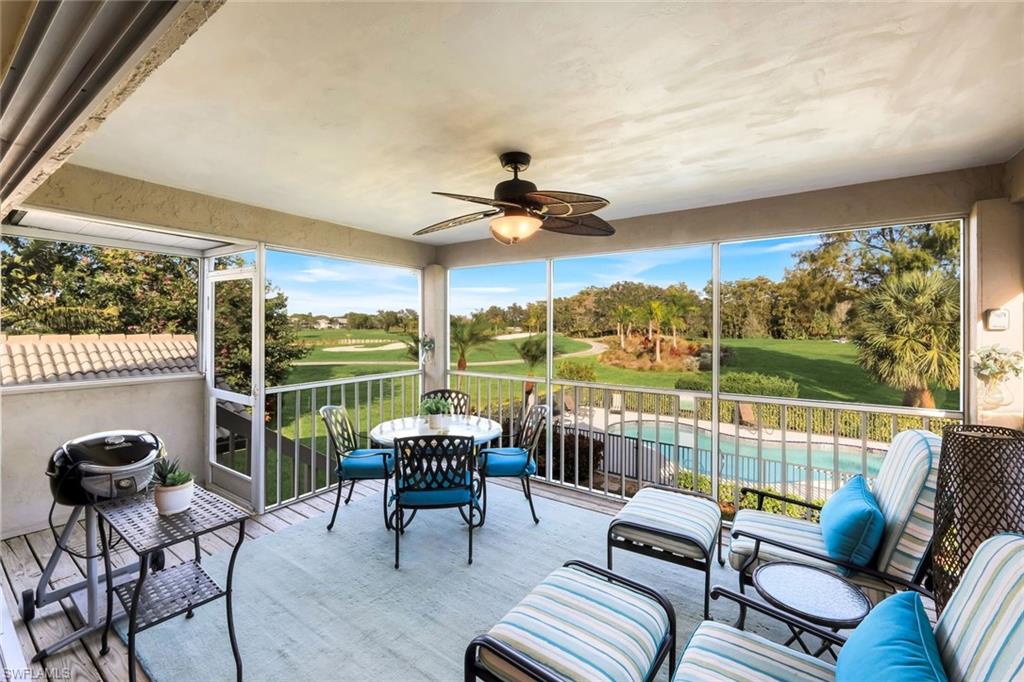 269 Perignon Place, Unit 162 Naples, FL 34119 - Photo 27 of 36 a balcony with furniture and a floor to ceiling window