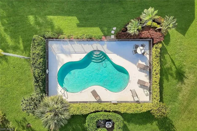 an aerial view of a golf course with parking space