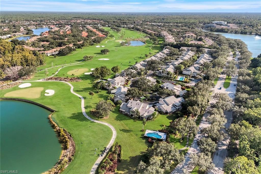 269 Perignon Place, Unit 162 Naples, FL 34119 - Photo 34 of 36 an aerial view of a golf course with parking space