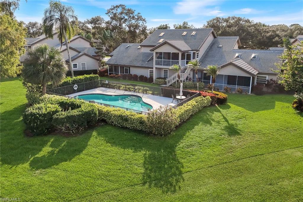 269 Perignon Place, Unit 162 Naples, FL 34119 - Photo 4 of 36 a view of a house with a big yard
