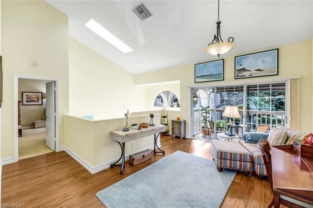 269 Perignon Place, Unit 162 Naples, FL 34119 - Photo 9 of 36 a living room with furniture and wooden floor