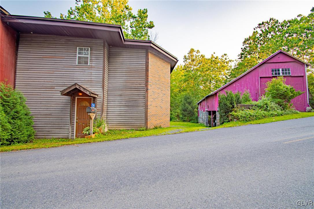 a view of backyard with garage