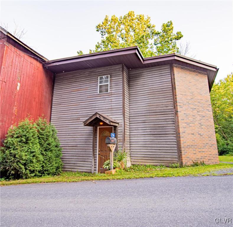 2516 Scout House Road Slatington, PA 18080 - Photo 2 of 22 a front view of a house with a yard and garage