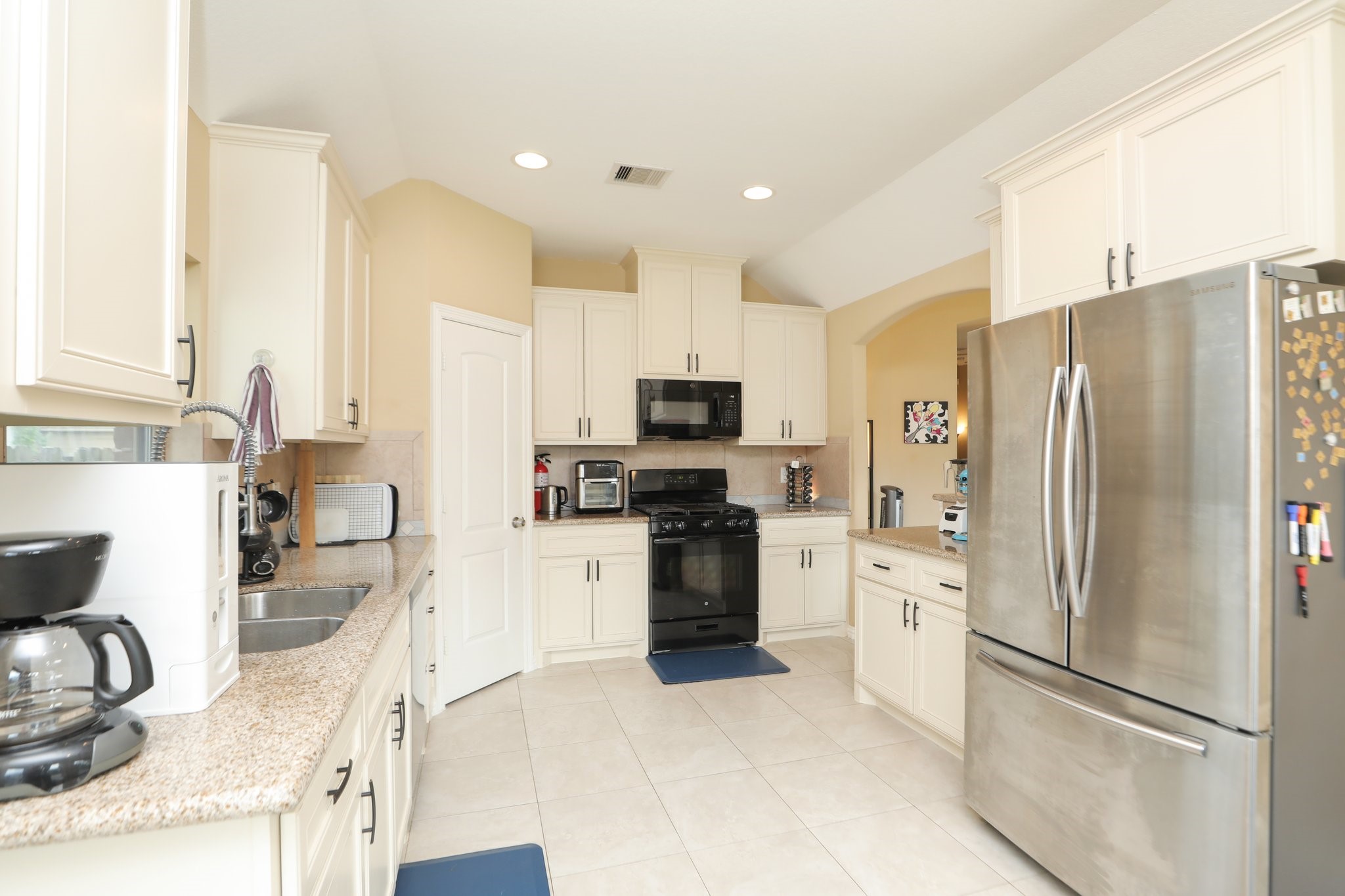 6615 Goldspier Street Houston, TX 77091 - Photo 14 of 37 Nice stainless steel refrigerator.