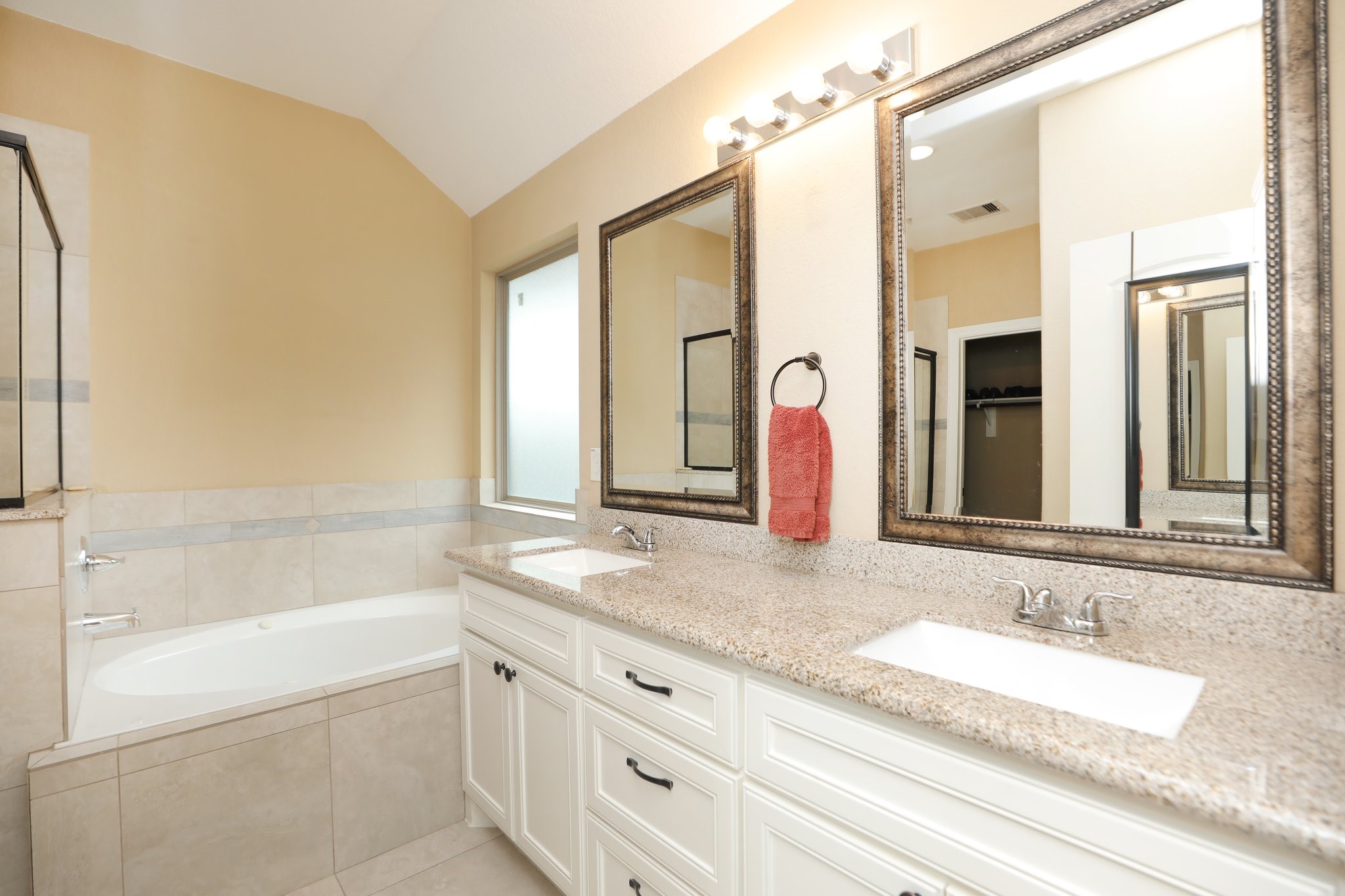 6615 Goldspier Street Houston, TX 77091 - Photo 21 of 37 Primary bath with granite tops, double sinks, soaking tub and separate walk-in shower.