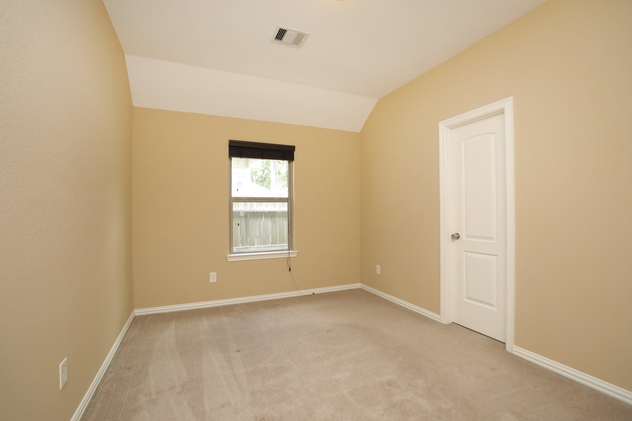 6615 Goldspier Street Houston, TX 77091 - Photo 28 of 37 Another big secondary bedroom with vaulted ceiling.