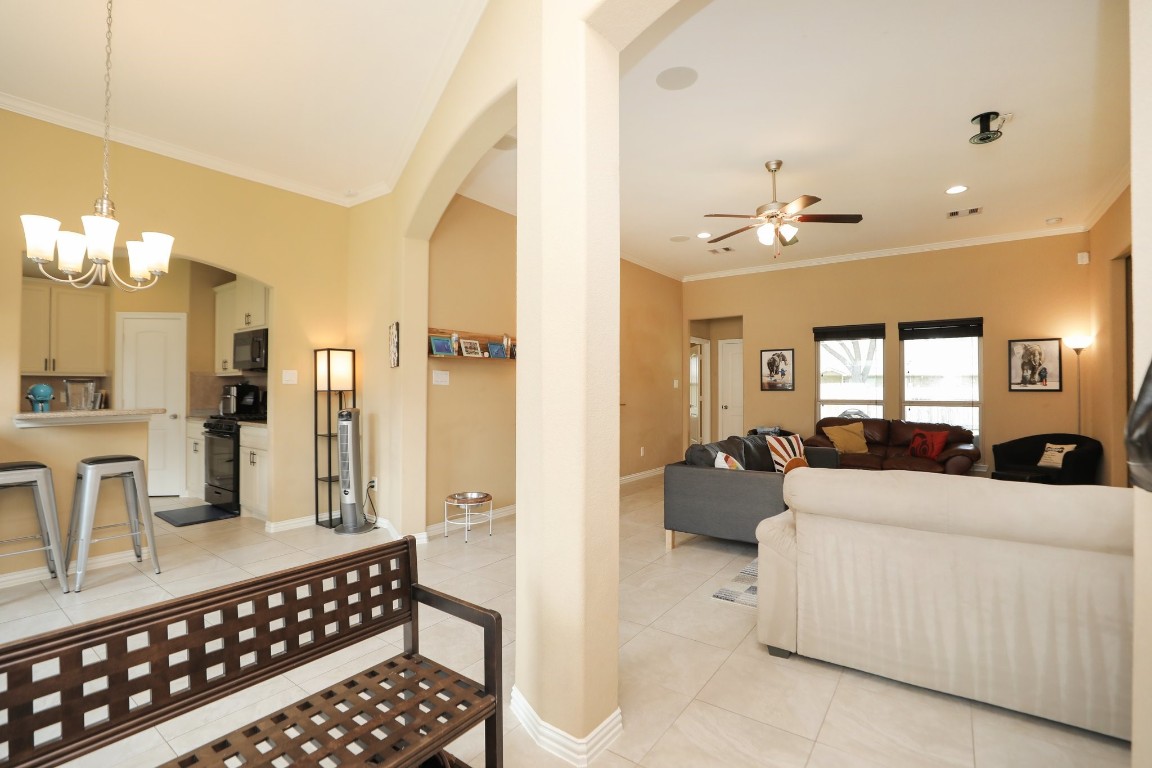 6615 Goldspier Street Houston, TX 77091 - Photo 37 of 37 Open concept floor plan with high ceilings and tile floors in the living areas. View from the front entry to living area and kitchen.