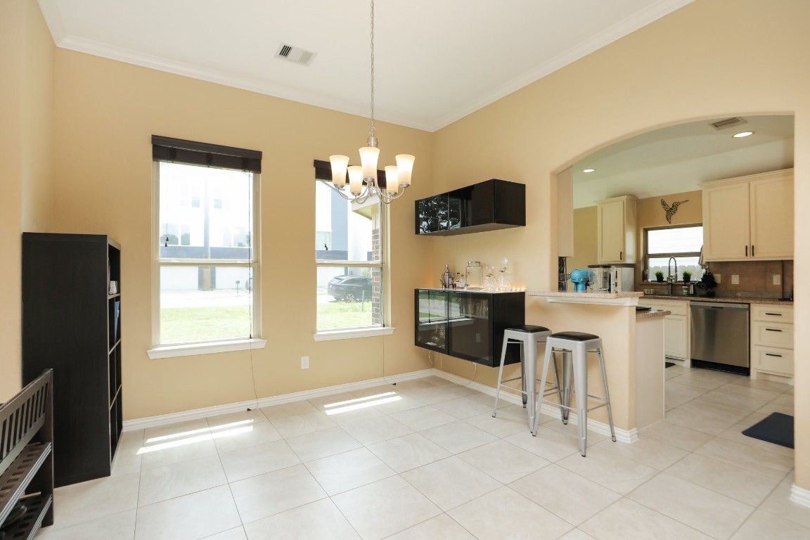 6615 Goldspier Street Houston, TX 77091 - Photo 9 of 37 Dining or study area in front of home with nice big windows opens to kitchen.