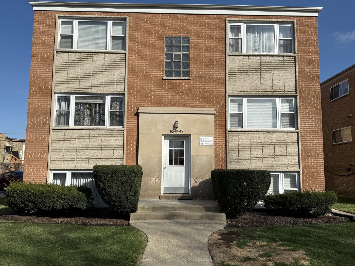 8549 Niles Center Road, Unit GN Skokie, IL 60077 - Photo 1 of 8 a view of a house with a yard and sitting area
