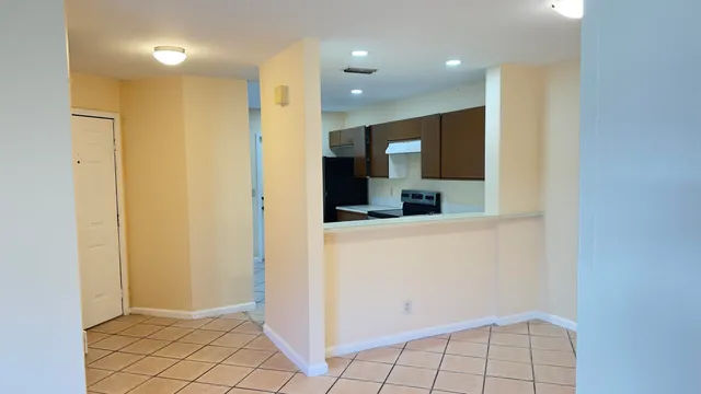 a view of kitchen with furniture and cabinets