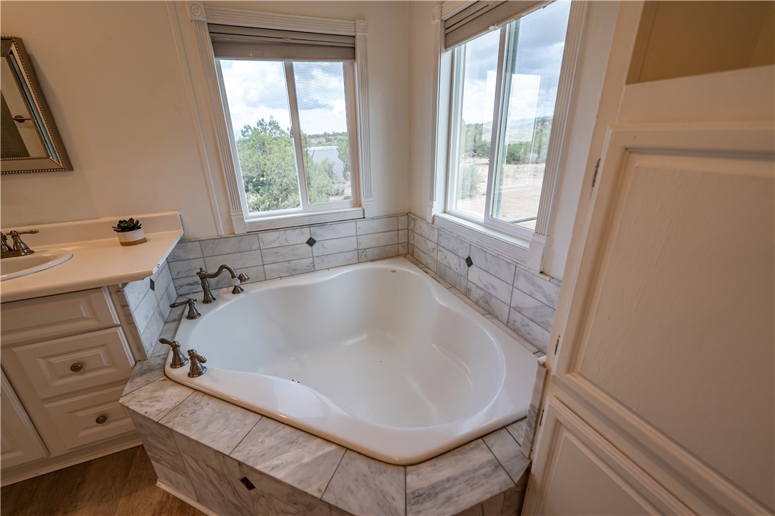2765 North Silver Springs Road Kingman, AZ 86401 - Photo 36 of 60 a bathroom with a sink and a bathtub