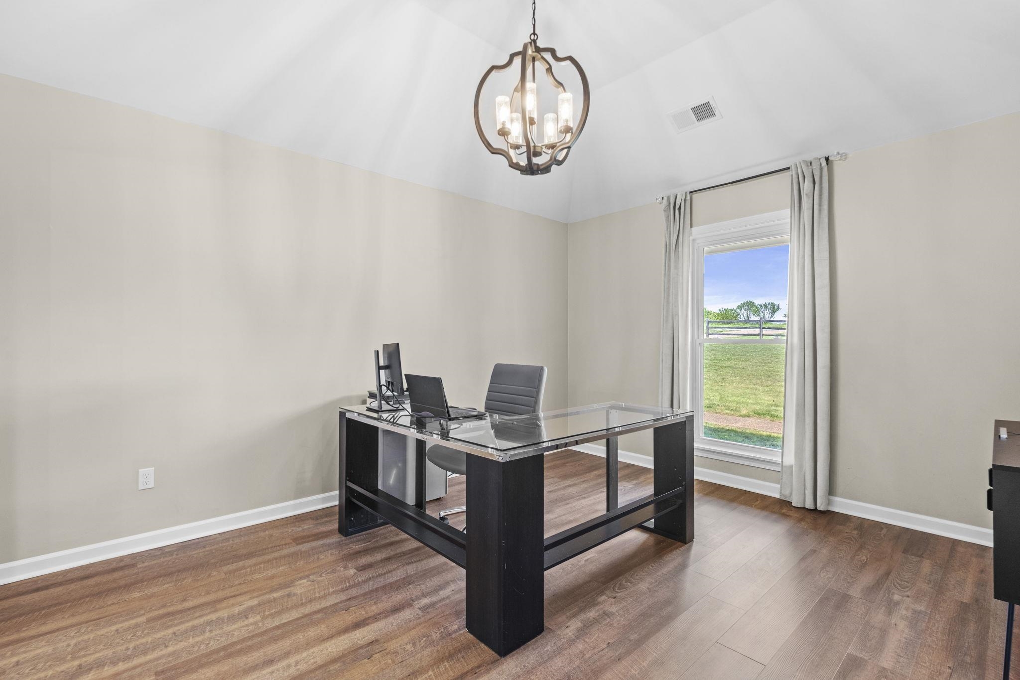 650 Firetower Road Somerville, TN 38068 - Photo 12 of 39 Office space featuring dark wood-style flooring, hanging lights, and vaulted ceiling