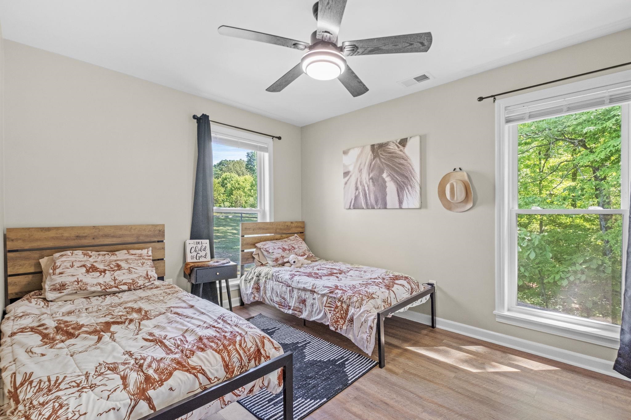 650 Firetower Road Somerville, TN 38068 - Photo 14 of 39 Bedroom featuring light wood-type flooring and ceiling fan