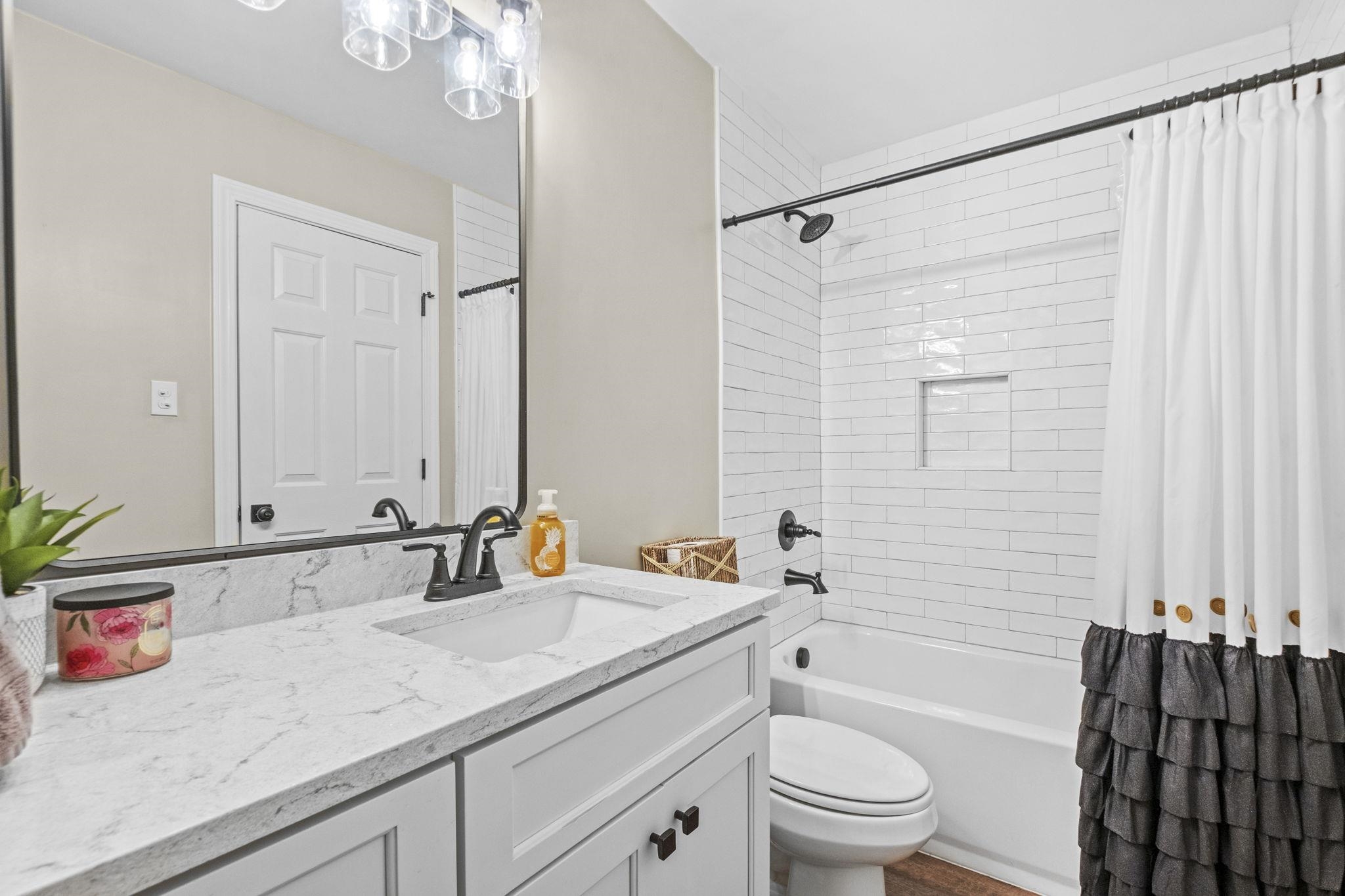 650 Firetower Road Somerville, TN 38068 - Photo 16 of 39 Full bath featuring vanity and shower / bathtub combination with curtain