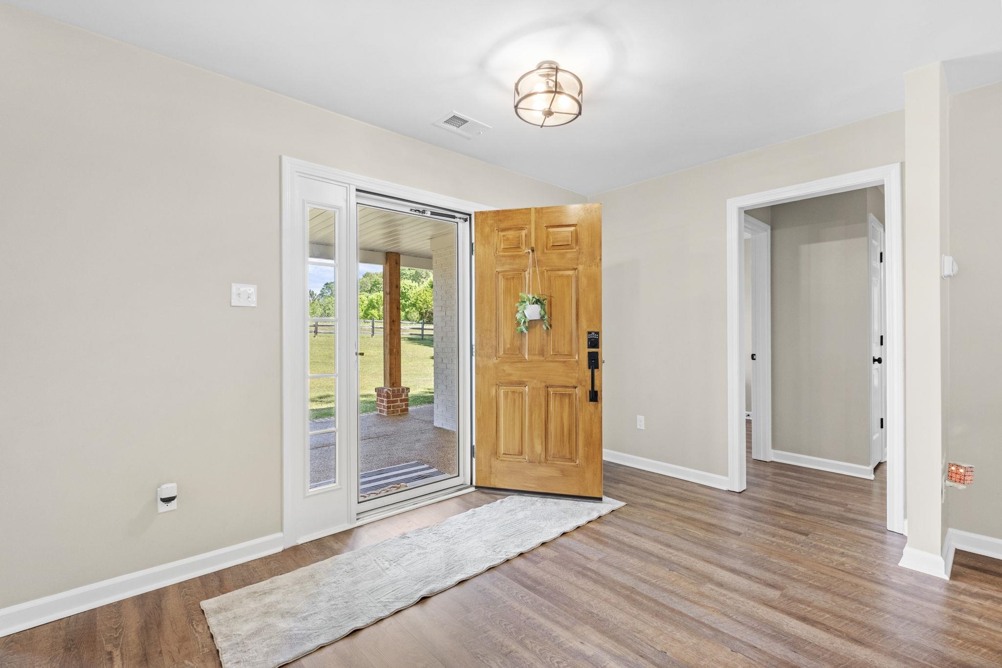 650 Firetower Road Somerville, TN 38068 - Photo 2 of 39 Foyer entrance featuring baseboards and light wood-style floors