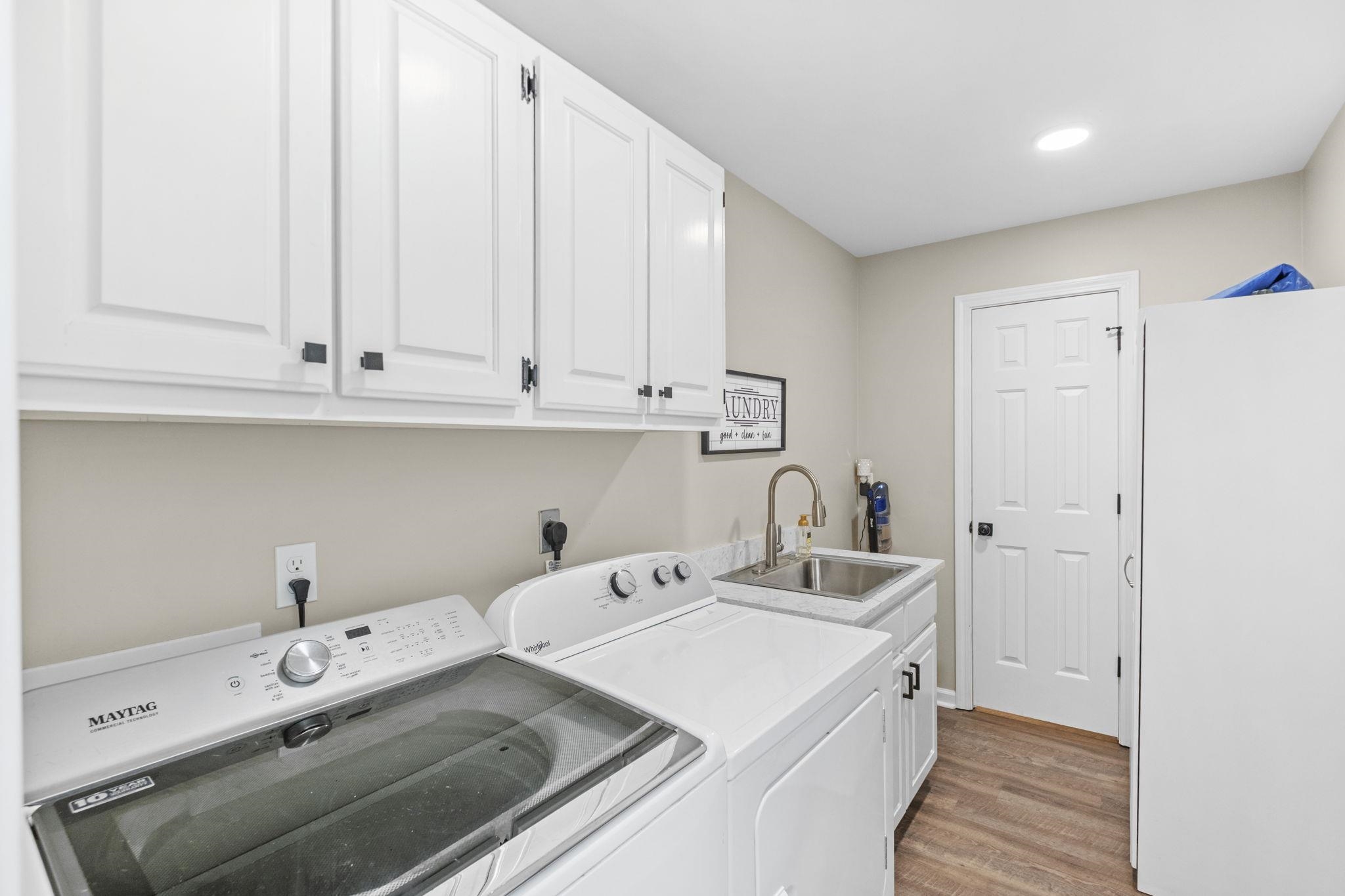 650 Firetower Road Somerville, TN 38068 - Photo 22 of 39 Laundry room with cabinet space, light wood-style flooring, independent washer and dryer, and recessed lighting