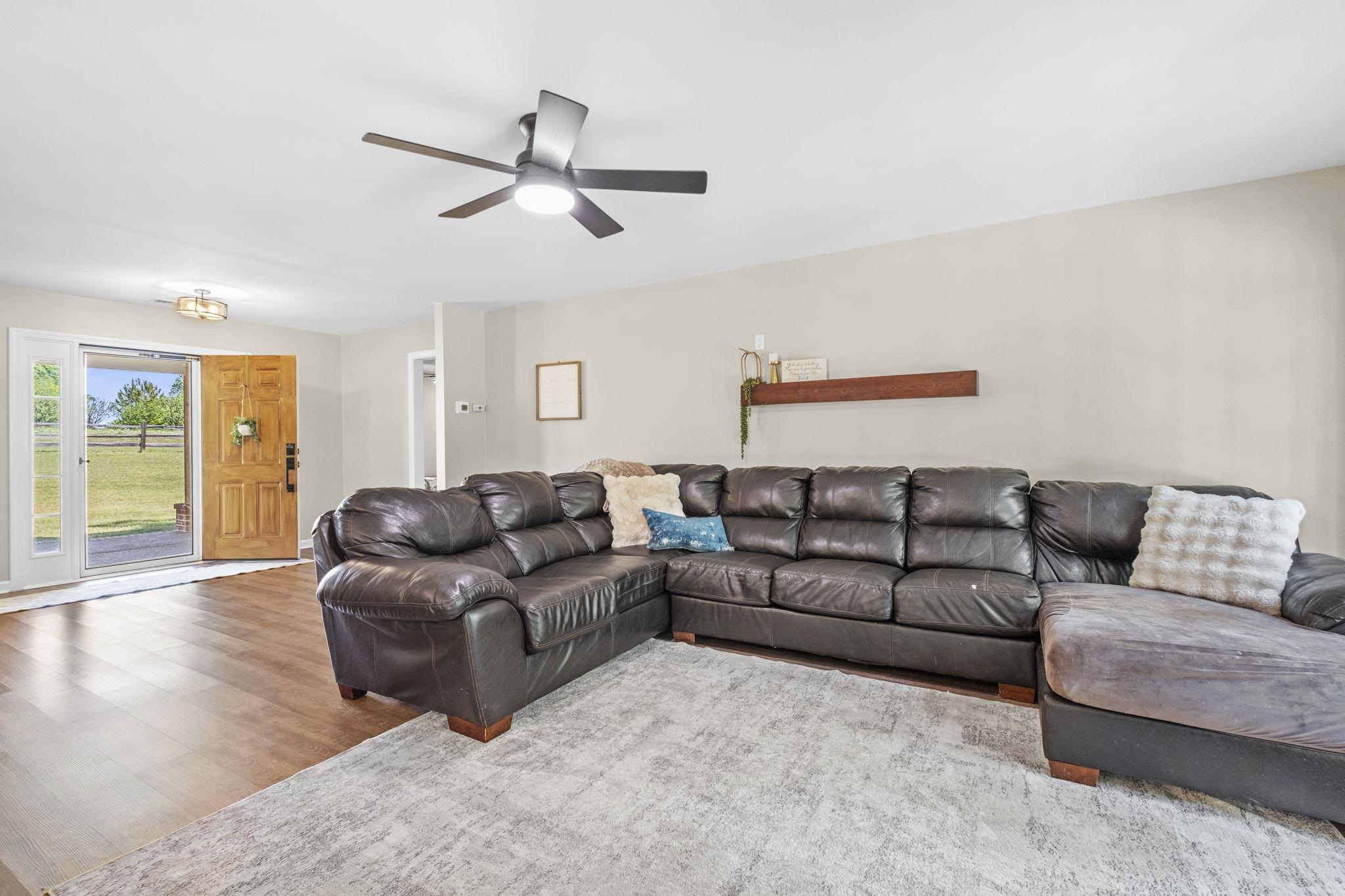 650 Firetower Road Somerville, TN 38068 - Photo 4 of 39 Living room featuring wood finished floors and a ceiling fan