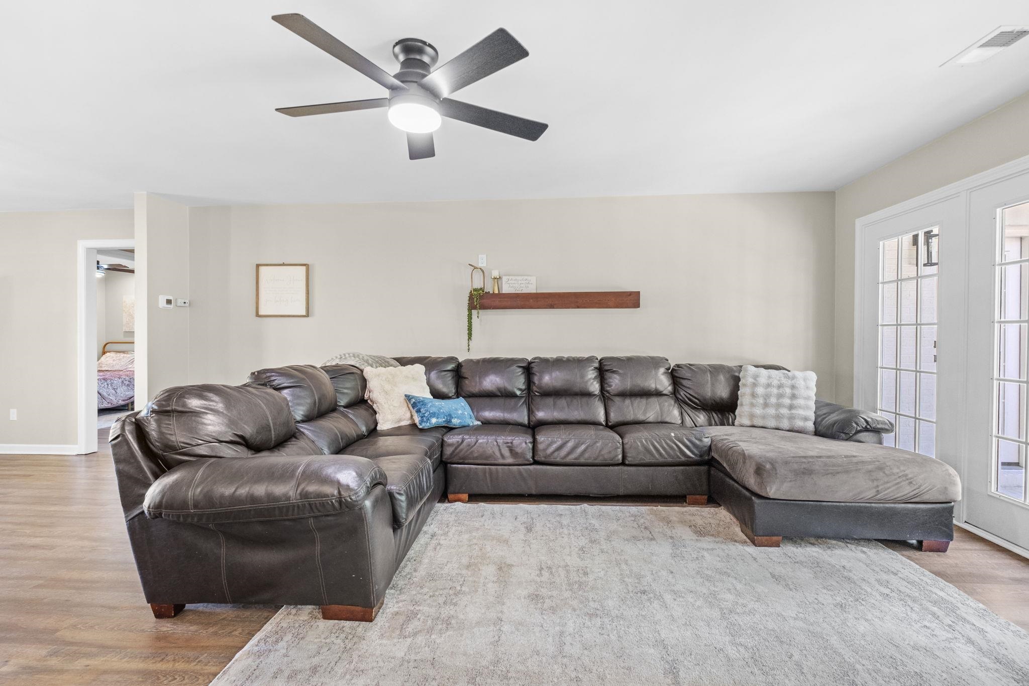 650 Firetower Road Somerville, TN 38068 - Photo 5 of 39 Living room featuring wood finished floors and a ceiling fan