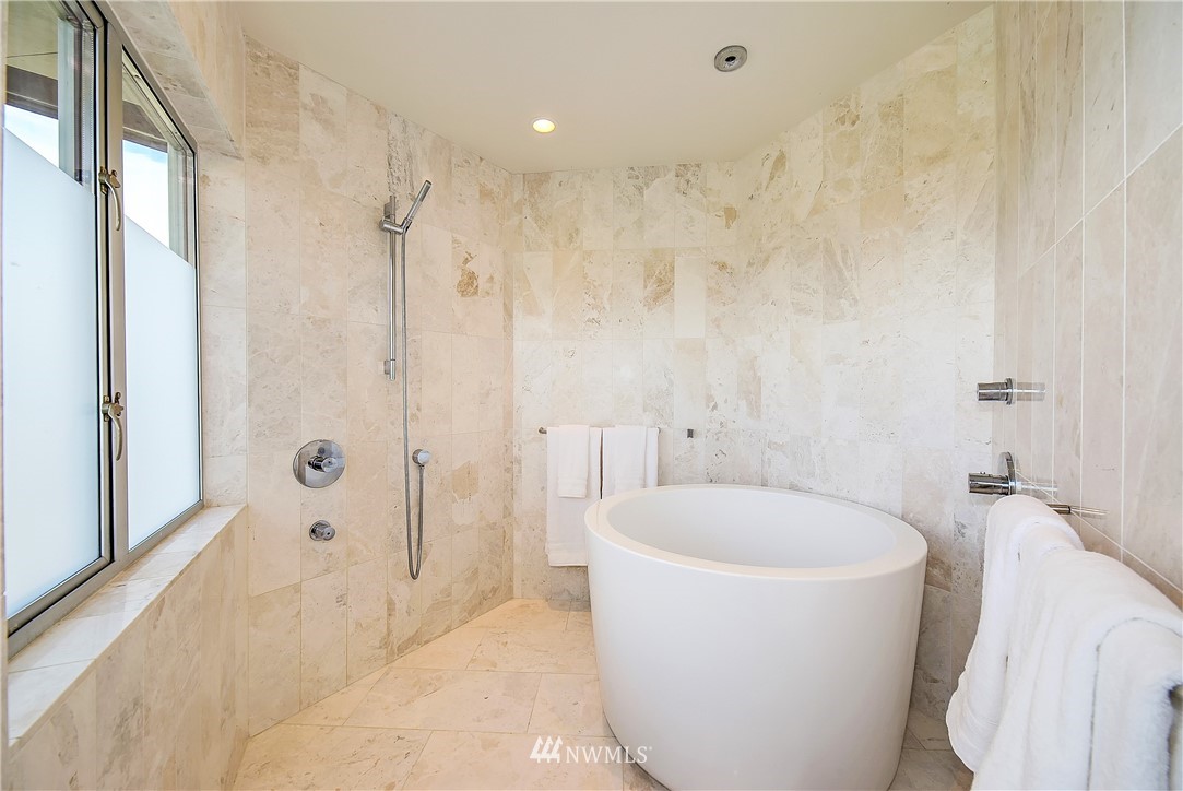 8631 Inverness Drive Northeast Seattle, WA 98115 - Photo 14 of 25 a white bath tub sitting in a bathroom