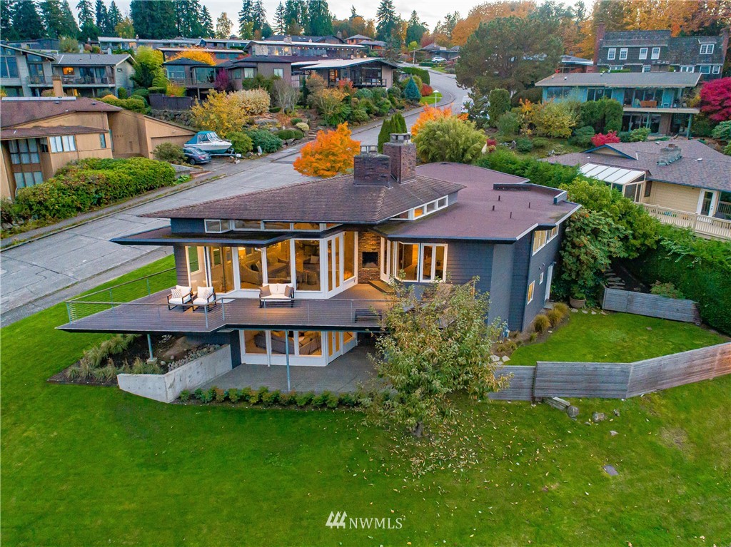 8631 Inverness Drive Northeast Seattle, WA 98115 - Photo 23 of 25 a aerial view of a house with a yard table and chairs