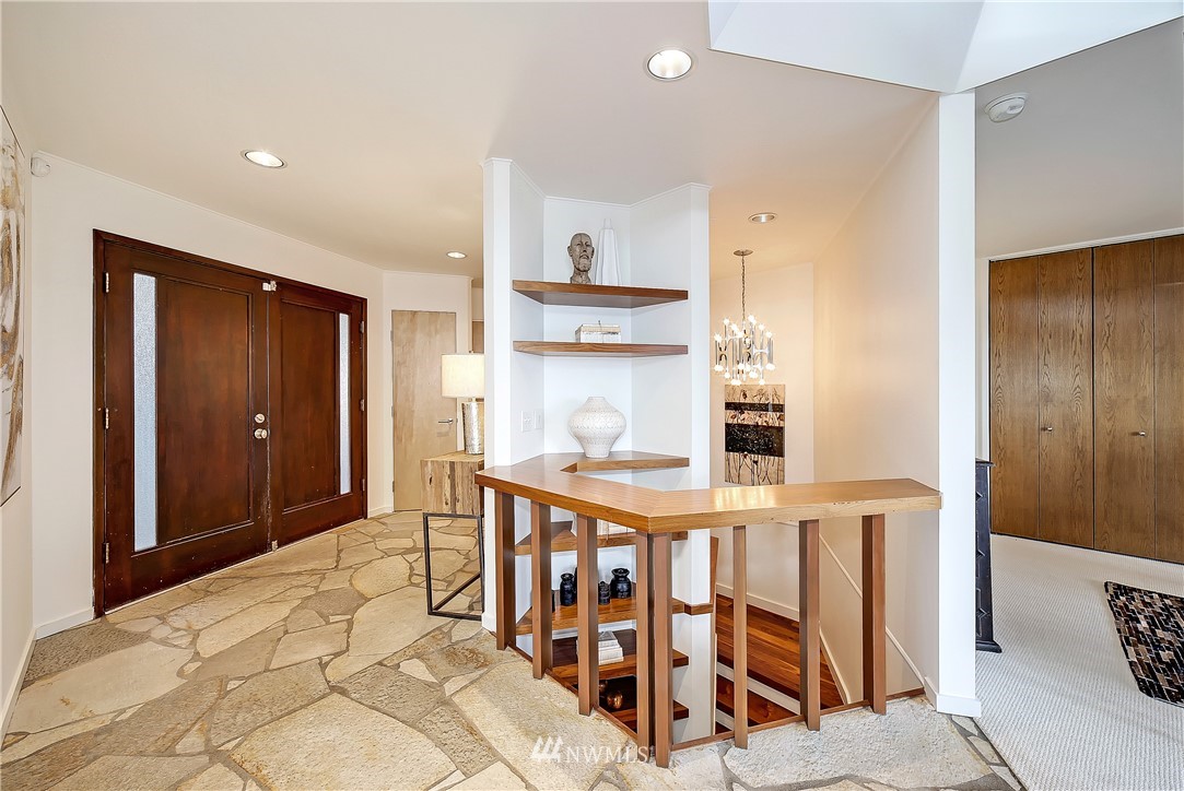 8631 Inverness Drive Northeast Seattle, WA 98115 - Photo 4 of 25 a very nice looking room with a large window and entryway