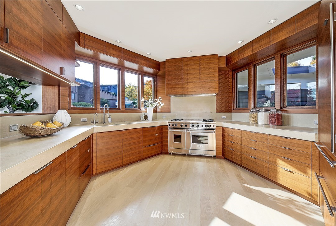 8631 Inverness Drive Northeast Seattle, WA 98115 - Photo 9 of 25 a large kitchen with stainless steel appliances and a large window