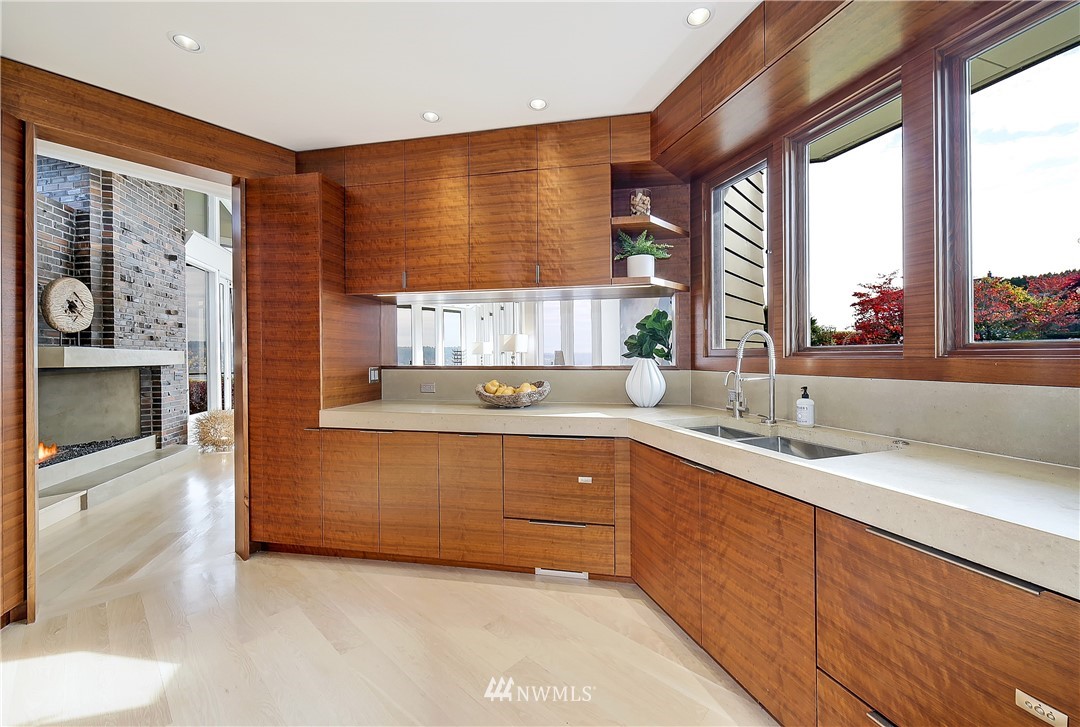 8631 Inverness Drive Northeast Seattle, WA 98115 - Photo 10 of 25 a kitchen with stainless steel appliances a sink window and cabinets