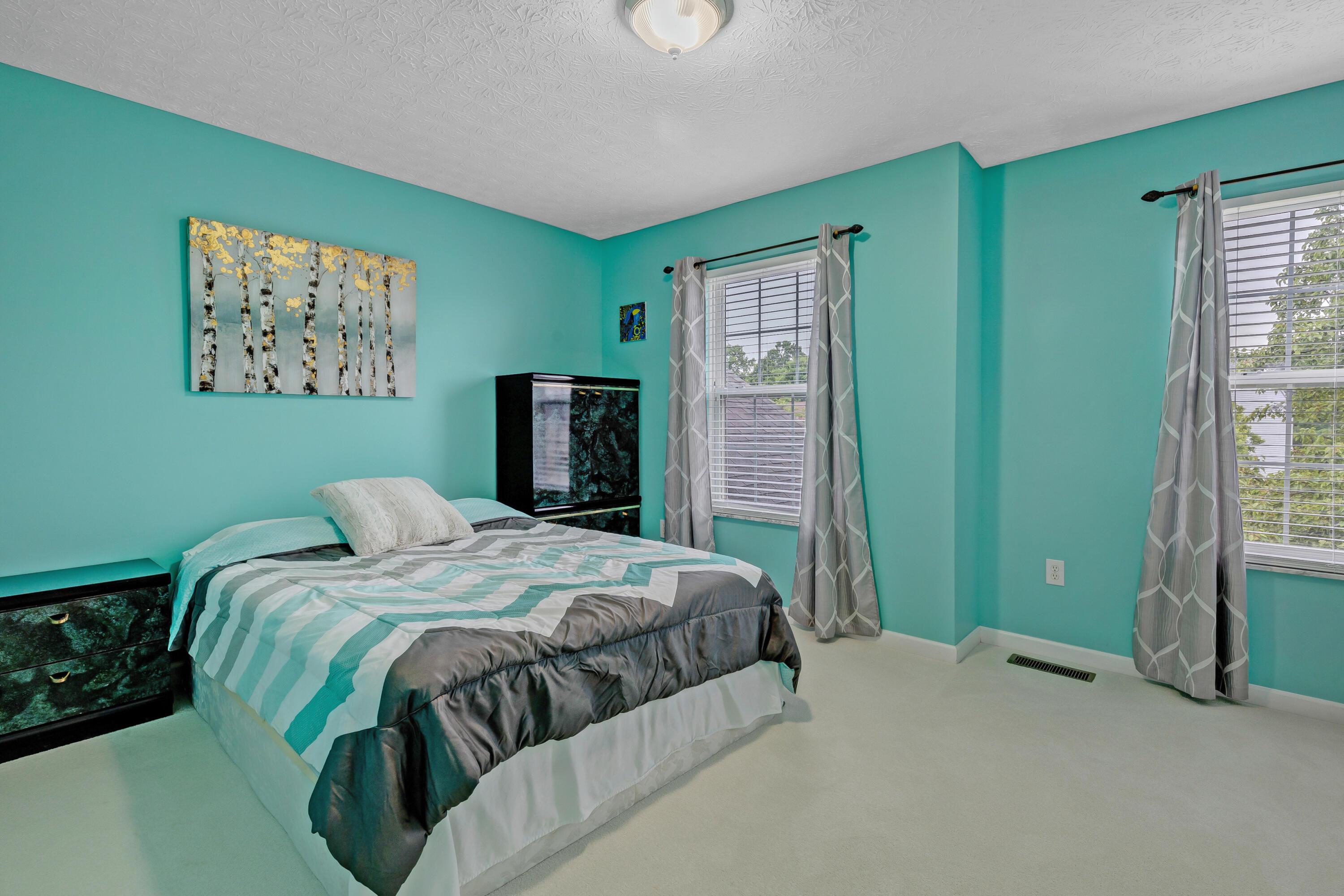 2136 Reeves Avenue Lewis Center, OH 43035 - Photo 39 of 57 • New light sand carpet ~ 2018 • Green painted walls • Ceiling light • Closet with double sliding doors • 2” blinds • Drapes remain