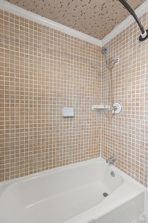 141 Prospect Street Gloucester, MA 01930 - Photo 11 of 32 a bathroom with a bathtub and a shower