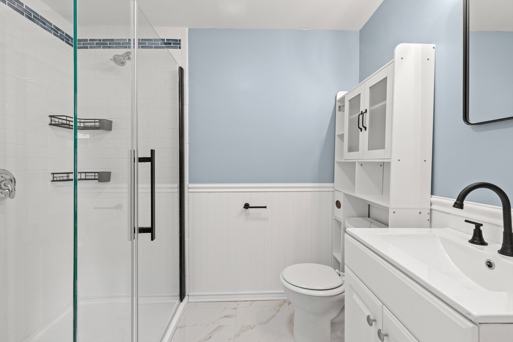 141 Prospect Street Gloucester, MA 01930 - Photo 19 of 32 a bathroom with a sink toilet and shower