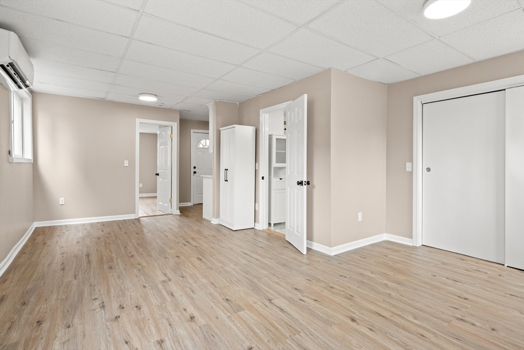 141 Prospect Street Gloucester, MA 01930 - Photo 22 of 32 a view of empty room with wooden floor