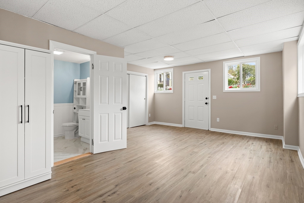 141 Prospect Street Gloucester, MA 01930 - Photo 26 of 32 an empty room with wooden floor and a window