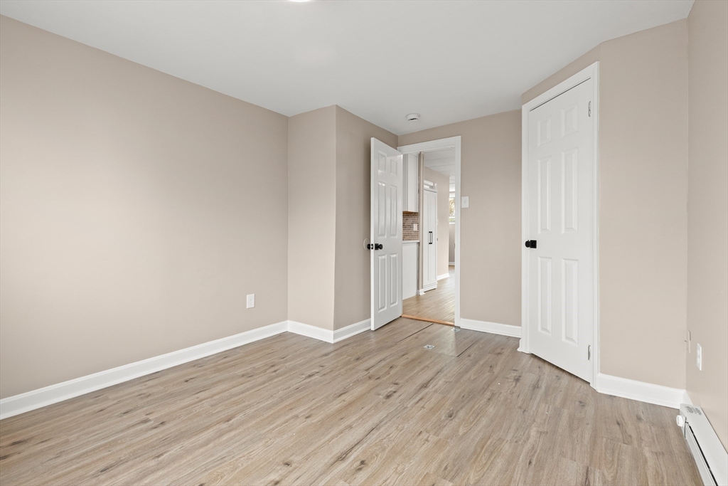 141 Prospect Street Gloucester, MA 01930 - Photo 29 of 32 a view of an empty room with wooden floor