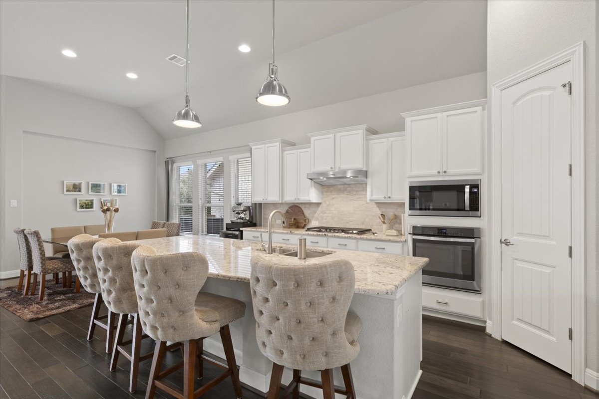 837 Bliss Lane Leander, TX 78641 - Photo 15 of 37 Stainless-steel appliances, including a gas cooktop, make cooking a delight.