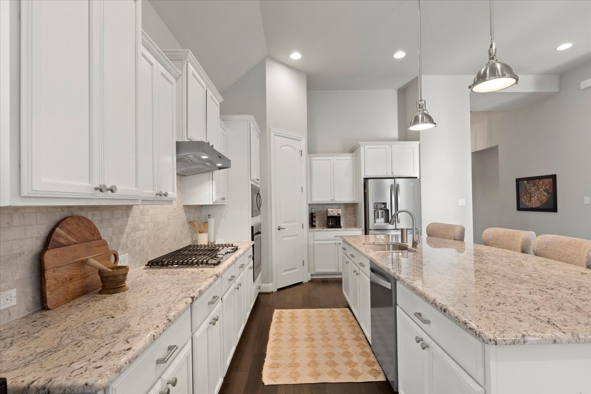 837 Bliss Lane Leander, TX 78641 - Photo 16 of 37 A modern touch-activated sink adds everyday convenience.