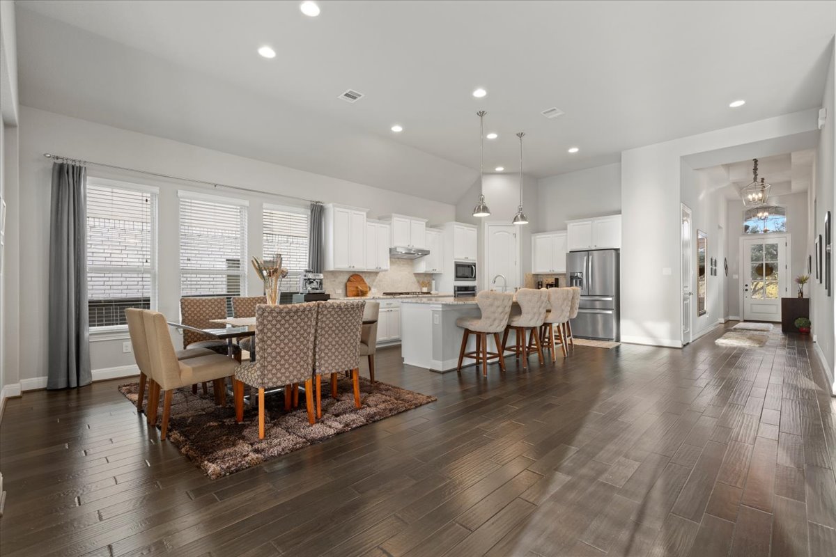 837 Bliss Lane Leander, TX 78641 - Photo 18 of 37 The dining area provides a seamless extension of the open-concept living space.