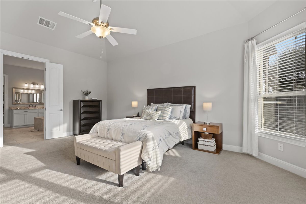 837 Bliss Lane Leander, TX 78641 - Photo 20 of 37 Natural light fills the primary bedroom, enhancing its bright and airy feel.