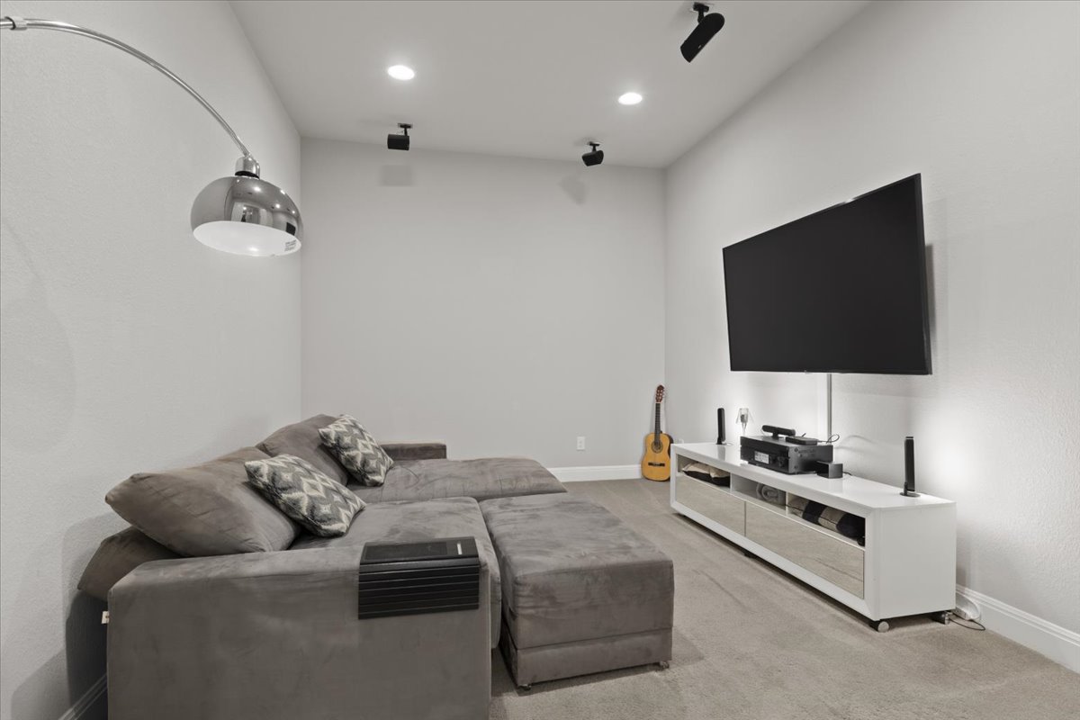 837 Bliss Lane Leander, TX 78641 - Photo 25 of 37 The dedicated media room is designed for immersive entertainment experiences.