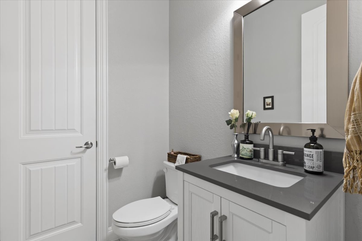 837 Bliss Lane Leander, TX 78641 - Photo 29 of 37 The well-appointed half bathroom features quality finishes and ample counter space.