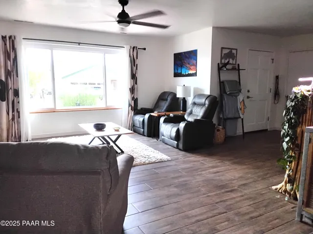 a kitchen with stainless steel appliances a refrigerator sink and microwave